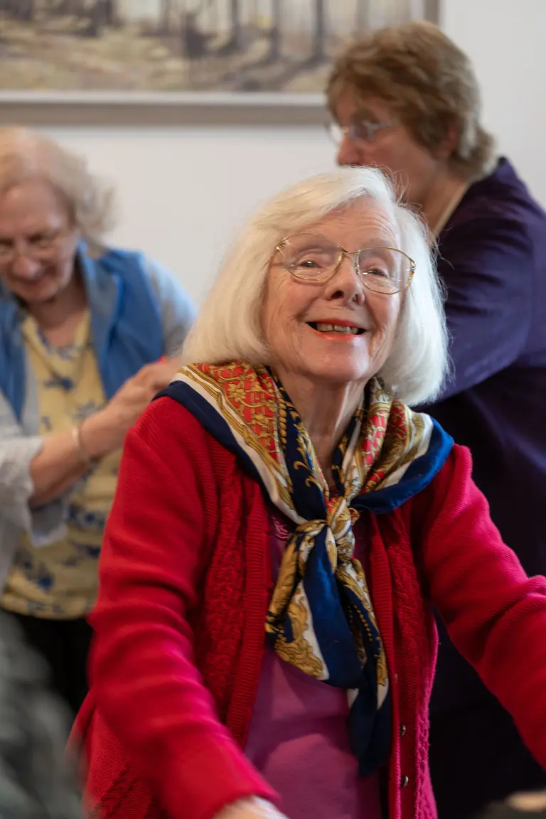A resident celebrating their 100th birthday with family
