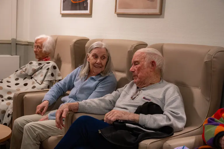 Two residents side by side in the lounge chairs at Aria Care Home