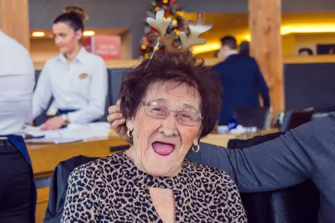 Residents, families and the team celebrating Christmas 2018.