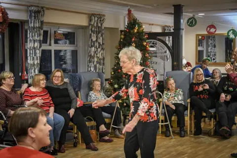 Residents, families and the team celebrating Christmas 2018.
