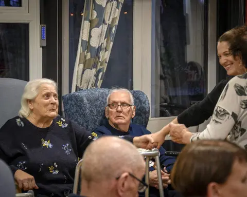 Residents, families and the team celebrating Christmas 2018.