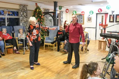 Residents, families and the team celebrating Christmas 2018.