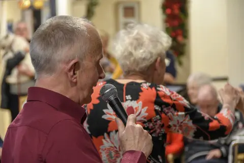 Residents, families and the team celebrating Christmas 2018.