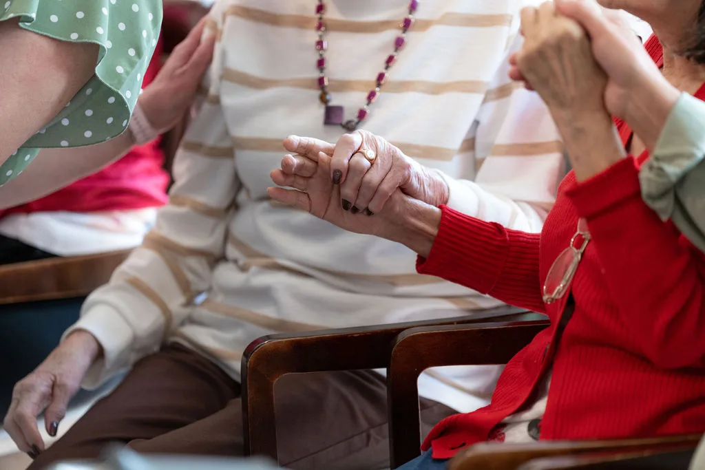 Hands held together during a respite stay at Aria Care Home, Newport